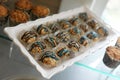 dessert tray with granola rice treats with chocolate and blue icing with focus on front