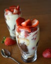 Dessert vanilla mousse with chocolate, strawberries and cookies in glass Royalty Free Stock Photo