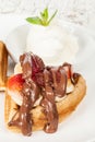 Dessert waffles with banana, strawberry, chocolate and ice cream Royalty Free Stock Photo