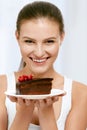 Dessert. Woman Eating Chocolate Cake Royalty Free Stock Photo