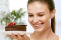 Dessert. Woman Eating Chocolate Cake Royalty Free Stock Photo