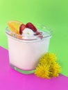 Dessert: yogurt with strawberries, currants, cream and orange