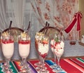 Desserts made of cream, berries and physalis in the tall wineglasses Royalty Free Stock Photo
