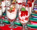 Desserts made of cream, berries and physalis in the tall wineglasses Royalty Free Stock Photo