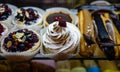 Desserts, pastries, cakes and various sweets at cafeteria and coffee shop window.