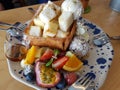 Desserts, Toast topped with vanilla ice cream, served with whipping cream and fruits with honey