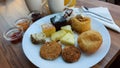 Desserts on a white porcelain plate. Oriental cookies. Ananas slices.