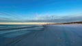 Destin, Florida beach at sunset with radiating cirrus clouds.