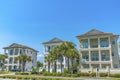 Destin, Florida- Facade of fenced three-storey beach houses