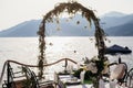 Destination wedding arch and banqouet covered table at sunset Royalty Free Stock Photo