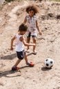 Destitute african american kids playing football