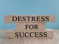 Destress for success symbol. Concept black words Destress for success on brick blocks.