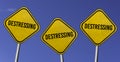 destressing - three yellow signs with blue sky background