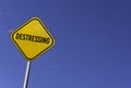 destressing - yellow sign with blue sky background Royalty Free Stock Photo