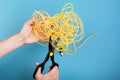 Destroy optical SC fiber by scissors.  on blue Royalty Free Stock Photo