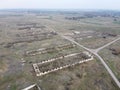 Destroyed agricultural buildings, aerial view. Abandoned livestock farm