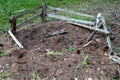 Destroyed anthill in the coniferous forest. Old anthill with a dilapidated fence