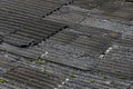 The destroyed asbestos roof in the dark weather