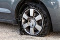 Blown out tire with exploded, shredded and damaged rubber