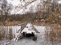 Destroyed boardwalk on a frozen pond