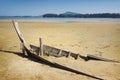 Destroyed boat in area of sea tide Royalty Free Stock Photo