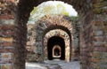 Destroyed brick arch old brickwork corridor long dark corridor under Royalty Free Stock Photo