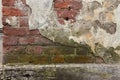 destroyed brick wall with fallen off plaster Royalty Free Stock Photo