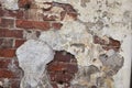 Destroyed brick wall with fallen off plaster Royalty Free Stock Photo
