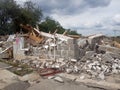 Destroyed building, earthquake, pile of rubble and debris,