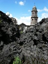 Destroyed cathedral protruding from lava