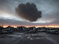 A destroyed city with broken cars and ruined buildings