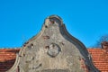 Destroyed facade of an old, historic building in a small village