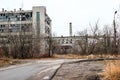 Destroyed factory in late autumn, empty and dirty production shop.