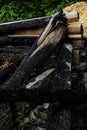 Destroyed by fire wooden house completely burned to the ground .ruins of a burnt wooden house after a fire Royalty Free Stock Photo