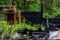 Destroyed by fire wooden house completely burned to the ground .ruins of a burnt wooden house after a fire Royalty Free Stock Photo