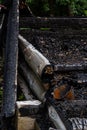 Destroyed by fire wooden house completely burned to the ground .ruins of a burnt wooden house after a fire Royalty Free Stock Photo