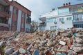 Destroyed homes ruins pile of concrete and bricks in after the earthquake. Demolished buildings, clearing rubble