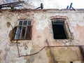 Destroyed house after a fire. Old brick building with Windows Royalty Free Stock Photo