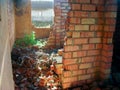 The destroyed inner walls of an empty brick house