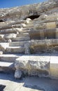 Destroyed marble stone stairs and seats in ancient theater in Side, Turkey