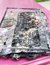 Destroyed notebook, melted plastic. Computer damage Royalty Free Stock Photo