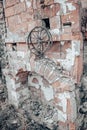 Destroyed old brick home stove concept photo. Damaged vintage oven on backyard.