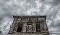 Destroyed old building on a gloomy sky with birds Royalty Free Stock Photo