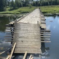 Destroyed old wooden bridge on the Ruza River in Russia