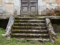 Destroyed porch and steps of the old mansion. Ruined entrance of former manor house Royalty Free Stock Photo