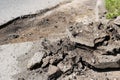 Destroyed road and fragments of asphalt, road repairs