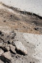 Destroyed road and fragments of asphalt, road repairs