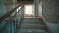 Destroyed school in Beslan after the terrorist attack. Old empty school corridors. The camera walks up the stairs.