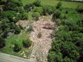 destroyed single family home, property totally damaged by propane leak disaster. Wide drone shot