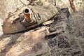 A destroyed Sudanese T-55 Soviet tank rots in the undergrowth in South Sudan Royalty Free Stock Photo